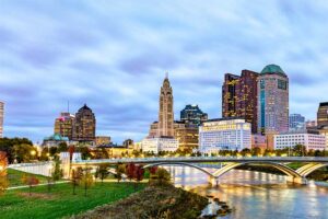 A photograph to represent Ohio, featuring a view of the river, a bridge, and the Columbus skyline.