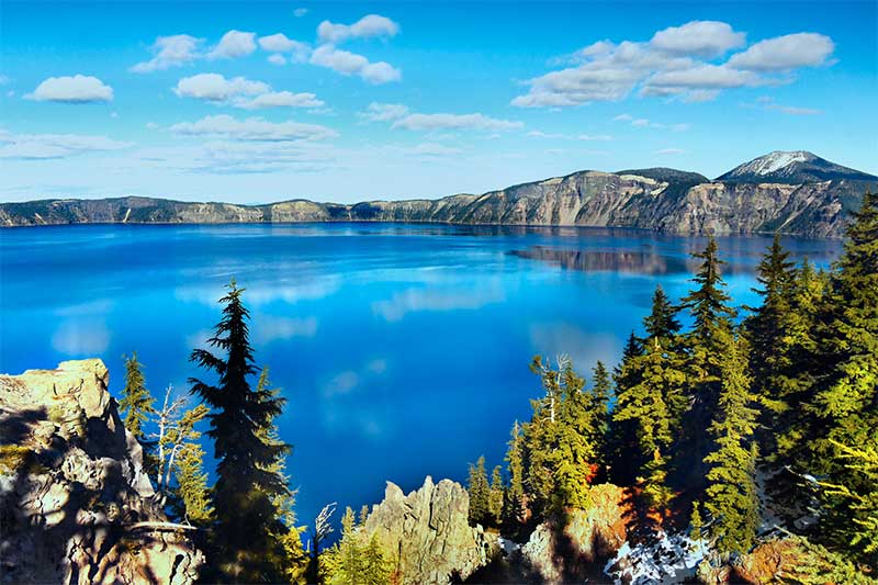 A photograph to represent Oregon, featuring Crater Lake on a beautiful sunny day.